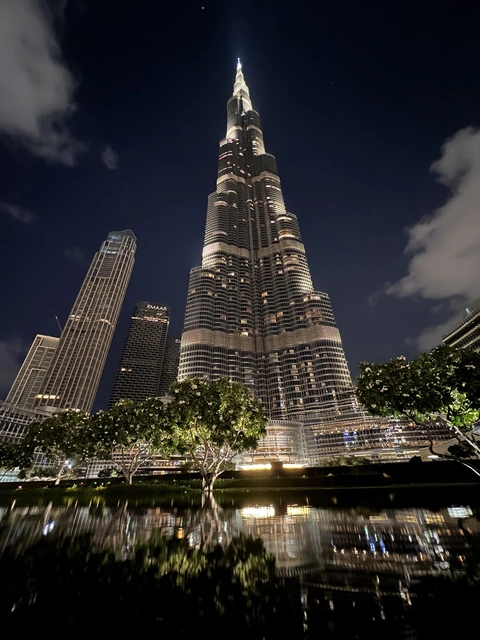 Burj Khalifa reflected in the water at night