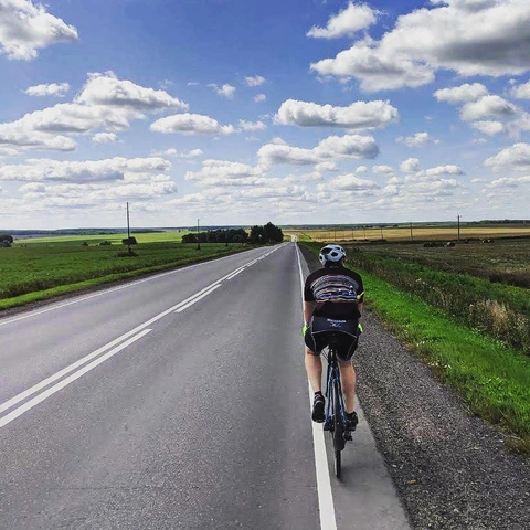 Cycling along an open country road